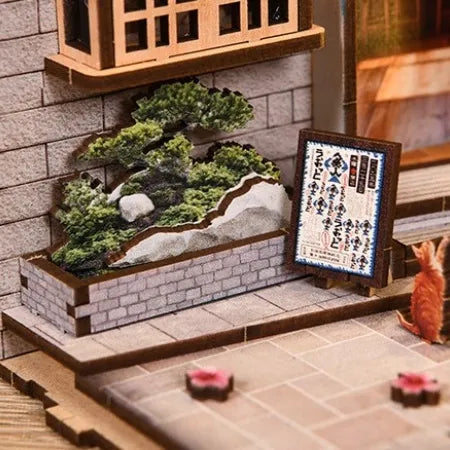 Jardín en miniatura con gato